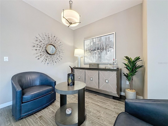 sitting room featuring light hardwood / wood-style floors