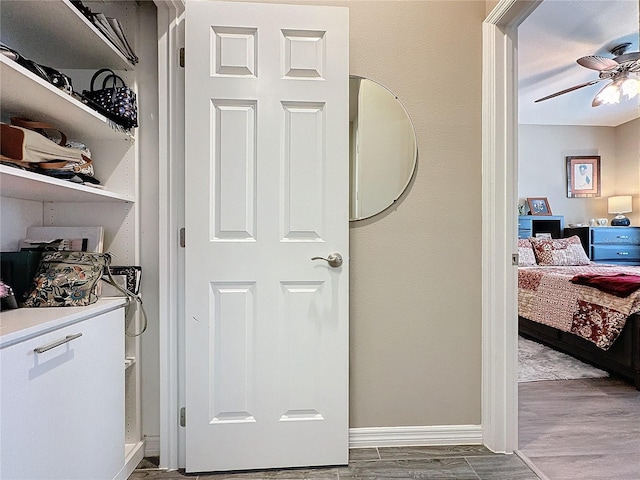 interior space with hardwood / wood-style floors and ceiling fan