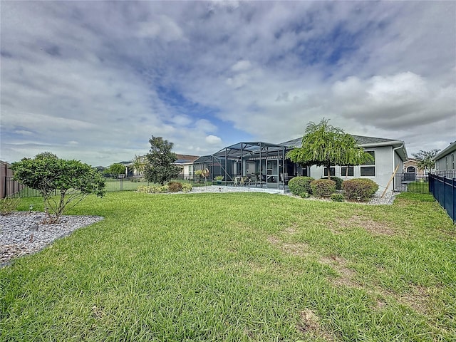 view of yard with a lanai