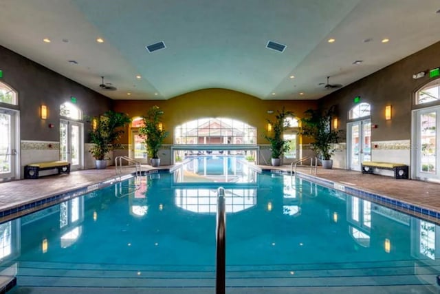 view of swimming pool featuring french doors