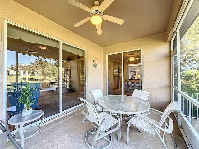 sunroom / solarium with ceiling fan