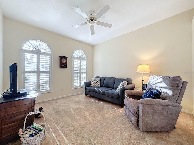 living room featuring light carpet and ceiling fan