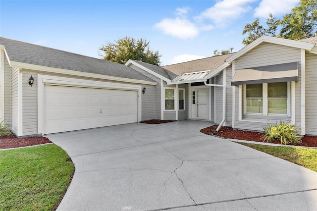 ranch-style home with a garage