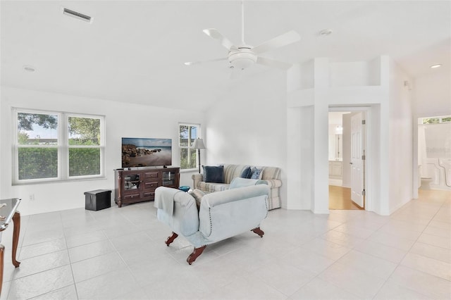 tiled living room featuring ceiling fan