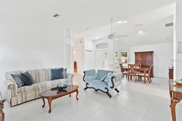 living room with lofted ceiling and ceiling fan