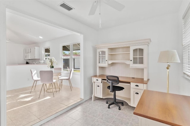 office space with ceiling fan and light tile patterned floors