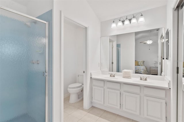 bathroom with lofted ceiling, toilet, tile patterned flooring, a shower with shower door, and vanity