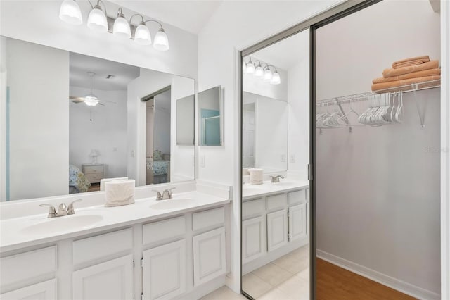 bathroom featuring vanity, ceiling fan, and tile patterned flooring