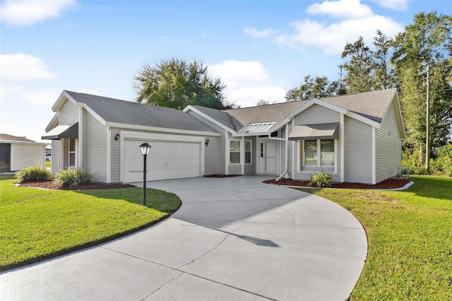 single story home with a garage and a front lawn