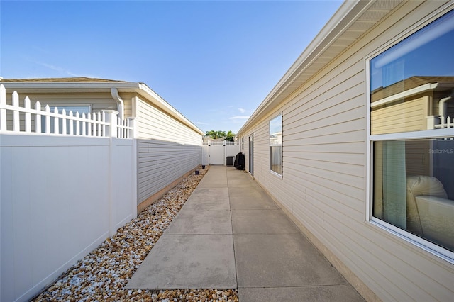 view of side of property featuring a patio