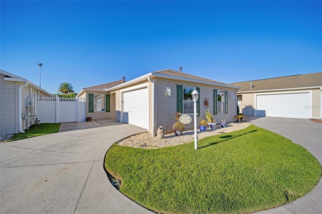 ranch-style house featuring a garage and a front lawn