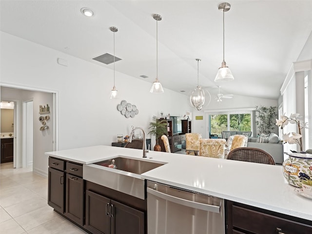 kitchen with sink, dark brown cabinets, ceiling fan, vaulted ceiling, and stainless steel dishwasher