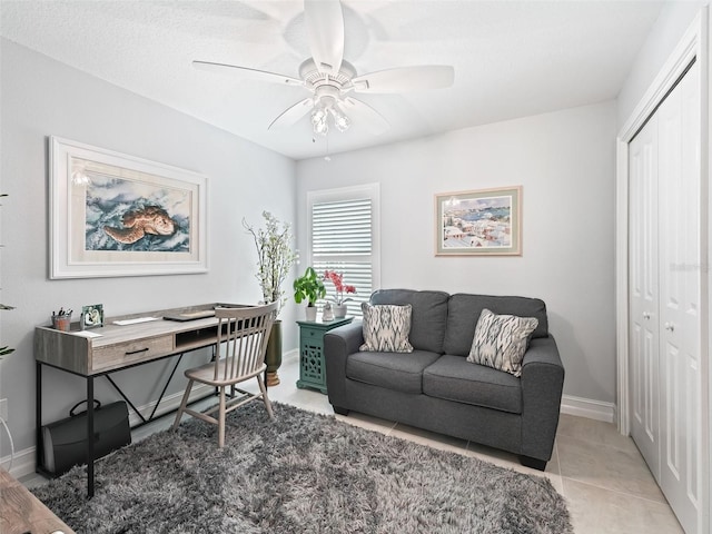 office space featuring ceiling fan and light tile patterned floors