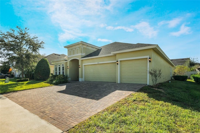 view of front facade with a front lawn and a garage