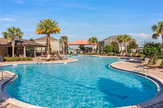 view of swimming pool featuring a patio area