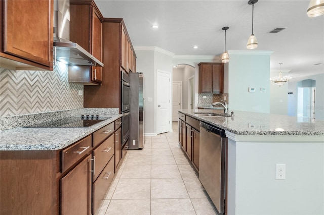 kitchen featuring decorative backsplash, crown molding, sink, decorative light fixtures, and appliances with stainless steel finishes