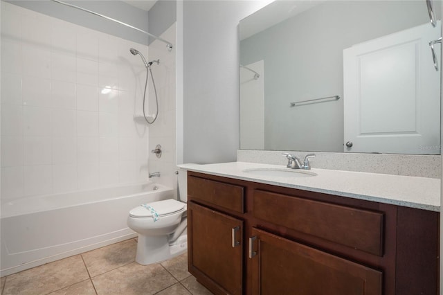 full bathroom with vanity, toilet, tile patterned floors, and tiled shower / bath combo