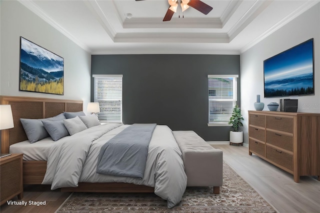 bedroom featuring multiple windows, ornamental molding, and wood-type flooring