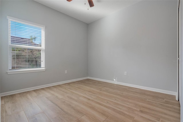 spare room featuring ceiling fan and light wood-type flooring