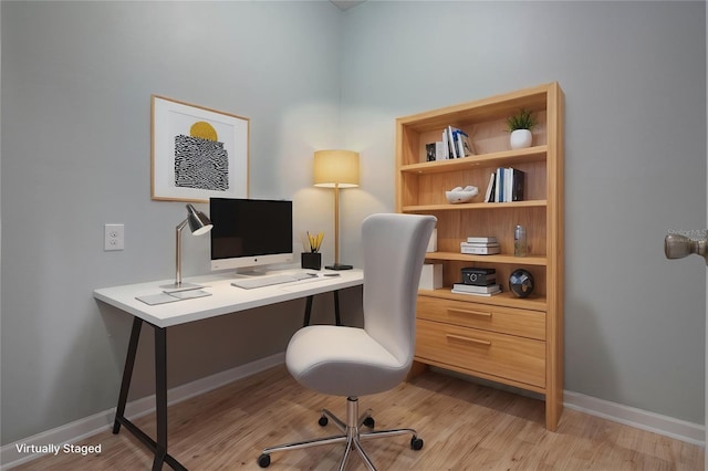 office with light wood-type flooring