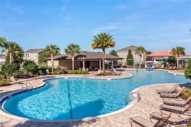 view of swimming pool featuring a patio area