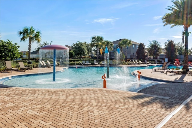 view of pool featuring pool water feature and a patio area