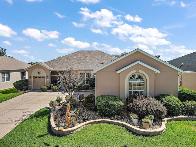 ranch-style house featuring a garage and a front lawn