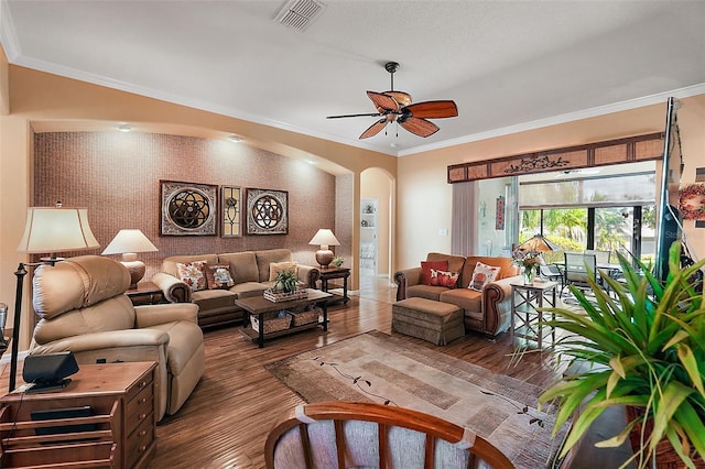 living room with ceiling fan, crown molding, and hardwood / wood-style floors