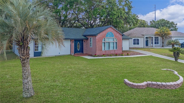 single story home with a front yard