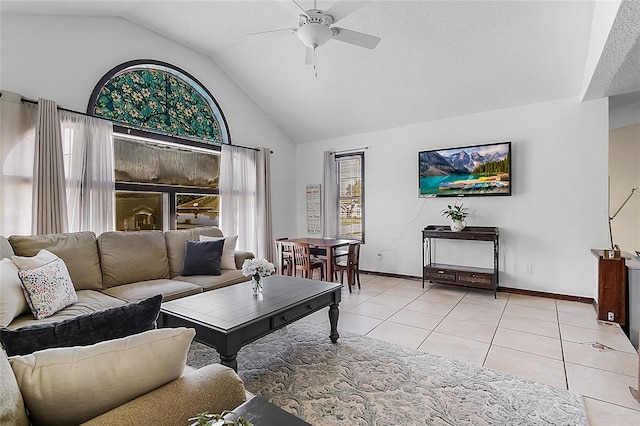 tiled living room with lofted ceiling and ceiling fan