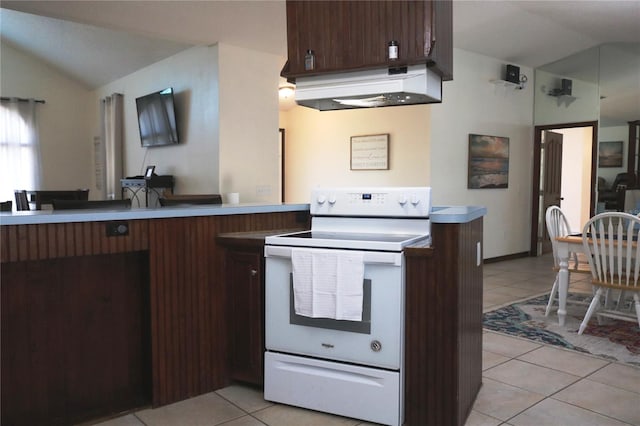 kitchen with vaulted ceiling, white electric range, and light tile patterned flooring