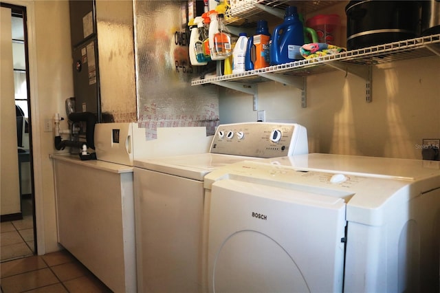 laundry area with washing machine and dryer and tile patterned flooring