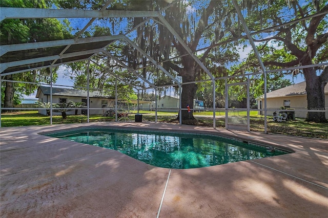 view of pool with a patio and a lanai