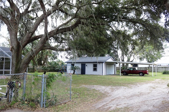 view of front of property with a carport and a front yard