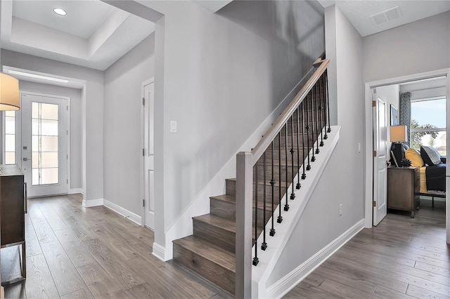 stairway featuring hardwood / wood-style flooring