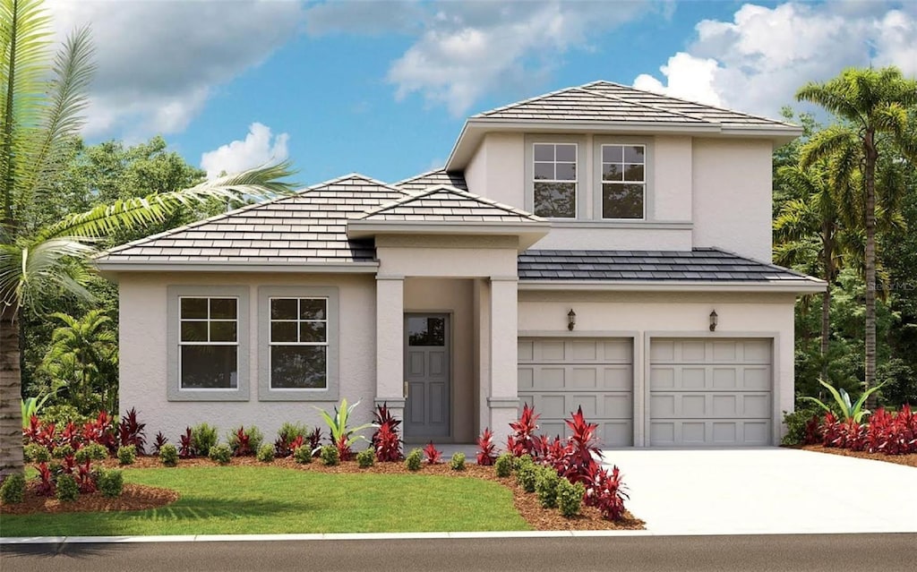 view of front facade with a front lawn and a garage