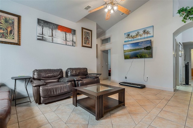 tiled living room featuring vaulted ceiling and ceiling fan