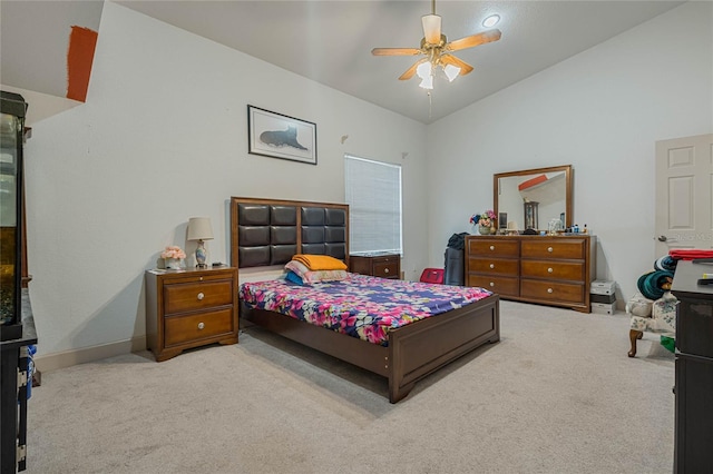 bedroom with ceiling fan, light carpet, and lofted ceiling