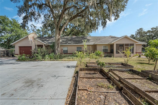 single story home featuring a garage