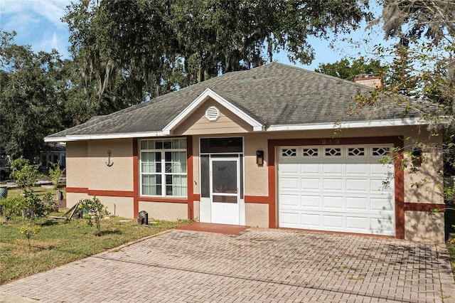 ranch-style home featuring a garage