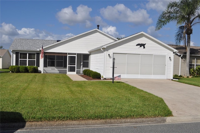 ranch-style home with a sunroom, a front lawn, and a garage