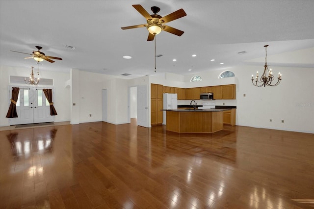 interior space featuring sink, dark hardwood / wood-style floors, ceiling fan with notable chandelier, and french doors