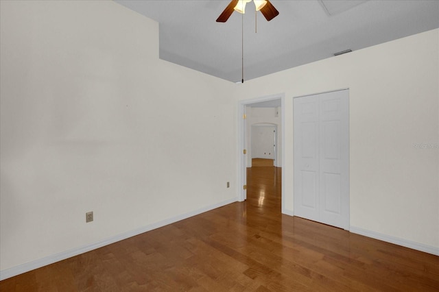 spare room with ceiling fan and hardwood / wood-style flooring