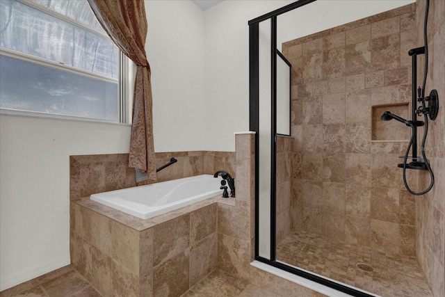 bathroom featuring independent shower and bath and tile patterned floors