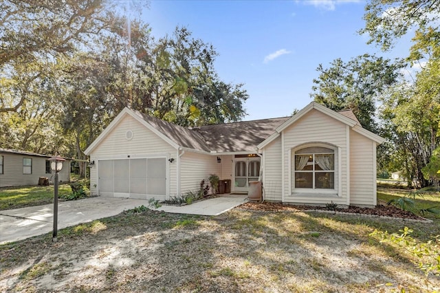 single story home with a garage