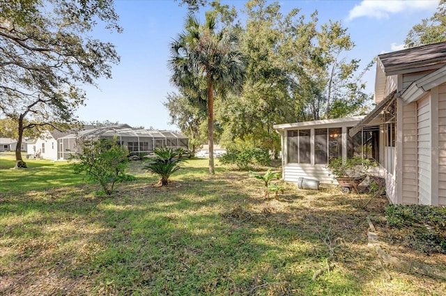 view of yard featuring a sunroom