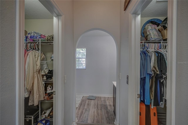 interior space with a textured ceiling and light wood-type flooring