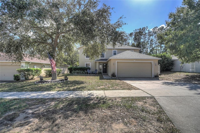 view of front of property with a garage and a front yard