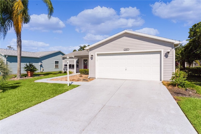 ranch-style home featuring a front lawn and a garage