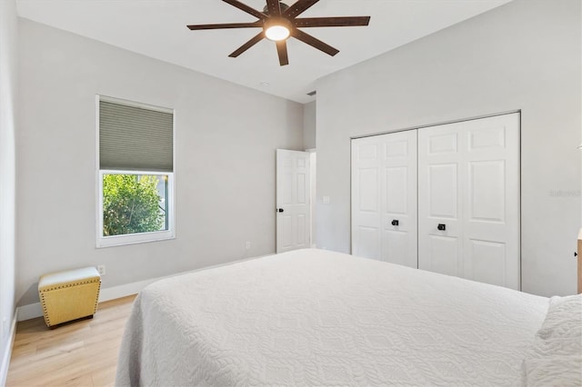 bedroom featuring a closet, light hardwood / wood-style floors, and ceiling fan